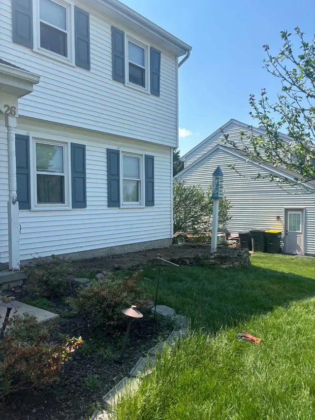 The same side of the house after the hedge was removed